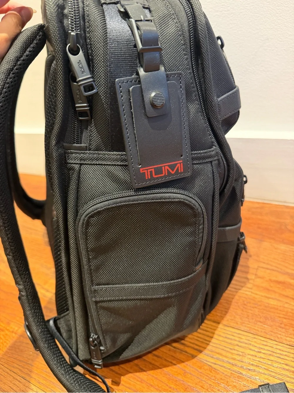 Tumi Black Backpack with Multiple Front Pockets